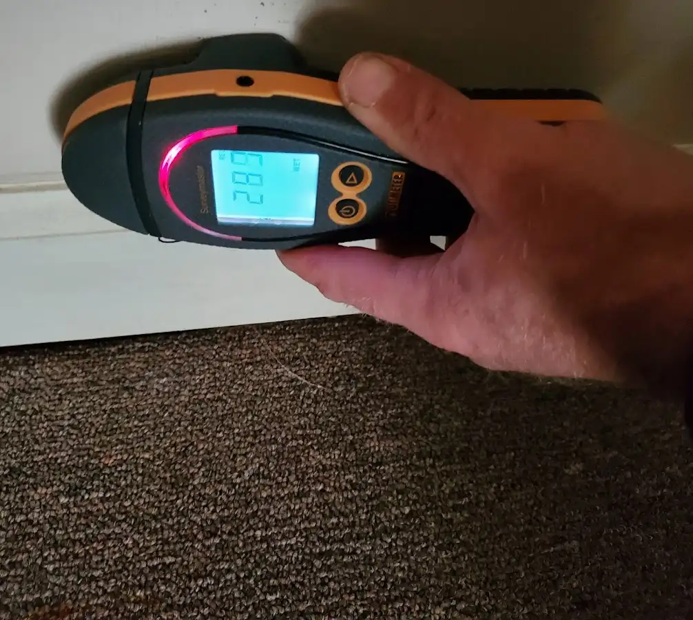 Moisture detection at baseboard during Storm Damage Restoration in Pleasant Hill